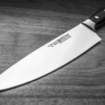 When must a knife be cleaned and sanitized
